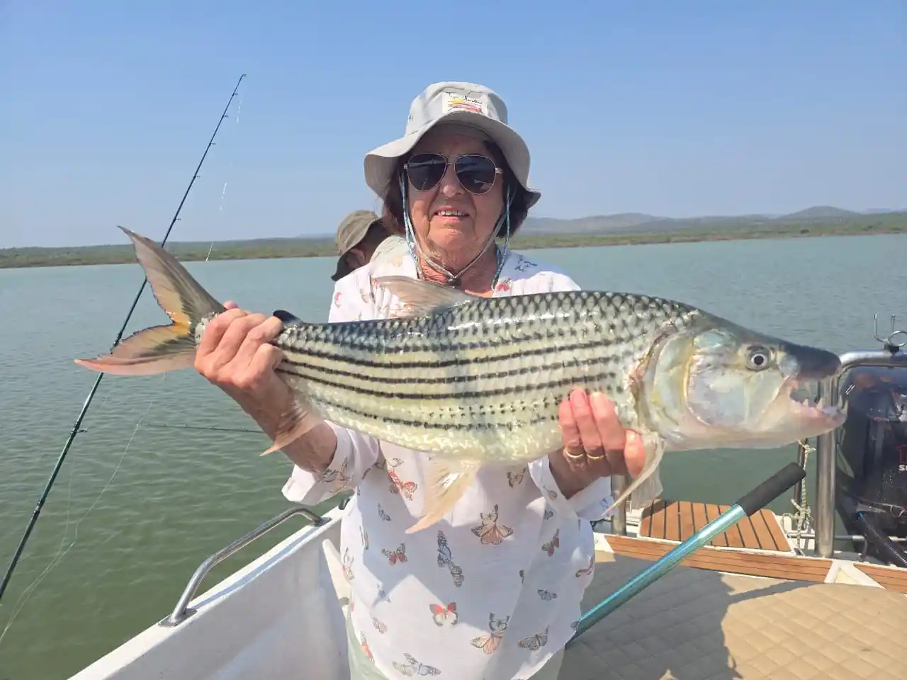 Young angler with a tiger fish caught on Pongola Dam